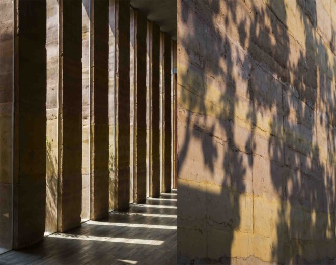 Dong Anh House by Vo Trong Nghia Architects, Dong Anh House in Hanoi, Dong Anh House in Vietnam, rammed earth modern architecture, rammed earth architecture in Hanoi, rammed earth housing in Vietnam, contemporary rammed earth house, fruit trees on a roof,