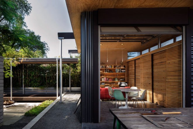 An overhang outside the south wall of the studio serves as a car port.