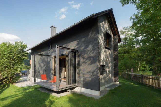 exterior image of the home shows one of the terraces