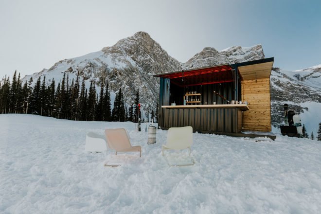 The bar sits on a snow-covered mountain.