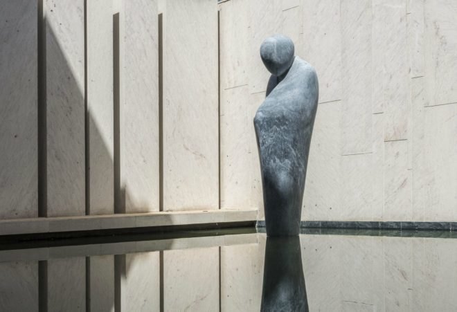 A stone sculpture outside the house.