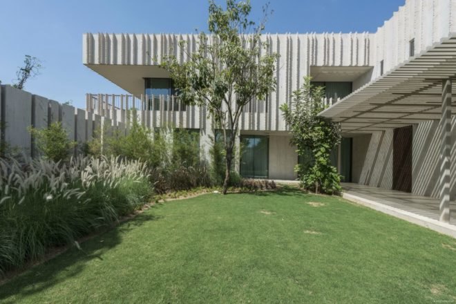 Image of the exterior of the home and some of its gardens.