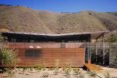 The home sits at the base of a canyon
