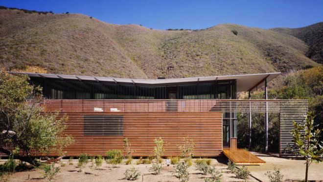 The home sits at the base of a canyon