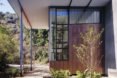 The roof extends past the outer walls to form covered terraces