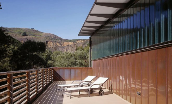 Patio with lounge chairs and canyon views