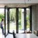 MILU by Qatarchitecten, green roof concrete extension, MILU house in Ghent, Ghent renovation and extension, board formed concrete extension, board formed concrete structural walls, operable glass garden backyard doors,