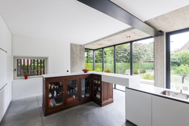 MILU by Qatarchitecten, green roof concrete extension, MILU house in Ghent, Ghent renovation and extension, board formed concrete extension, board formed concrete structural walls, operable glass garden backyard doors,