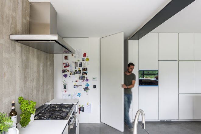 MILU by Qatarchitecten, green roof concrete extension, MILU house in Ghent, Ghent renovation and extension, board formed concrete extension, board formed concrete structural walls, operable glass garden backyard doors,