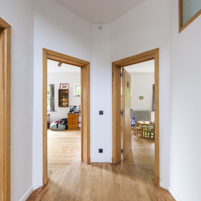 MILU by Qatarchitecten, green roof concrete extension, MILU house in Ghent, Ghent renovation and extension, board formed concrete extension, board formed concrete structural walls, operable glass garden backyard doors,