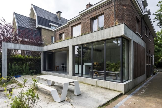 MILU by Qatarchitecten, green roof concrete extension, MILU house in Ghent, Ghent renovation and extension, board formed concrete extension, board formed concrete structural walls, operable glass garden backyard doors,