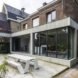MILU by Qatarchitecten, green roof concrete extension, MILU house in Ghent, Ghent renovation and extension, board formed concrete extension, board formed concrete structural walls, operable glass garden backyard doors,