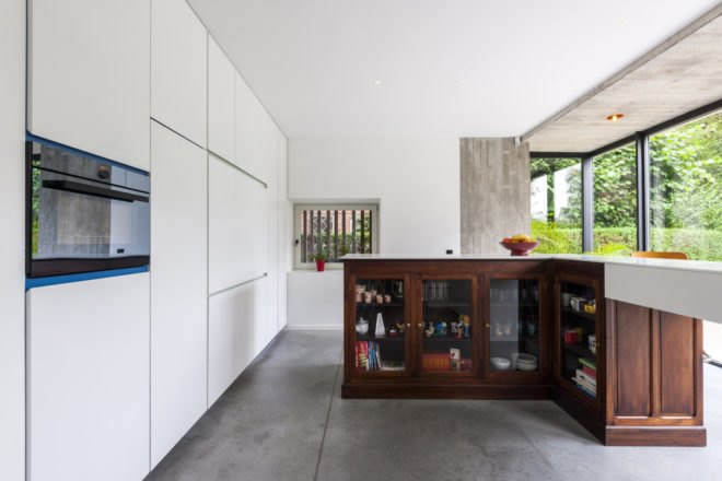 MILU by Qatarchitecten, green roof concrete extension, MILU house in Ghent, Ghent renovation and extension, board formed concrete extension, board formed concrete structural walls, operable glass garden backyard doors,