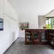 MILU by Qatarchitecten, green roof concrete extension, MILU house in Ghent, Ghent renovation and extension, board formed concrete extension, board formed concrete structural walls, operable glass garden backyard doors,