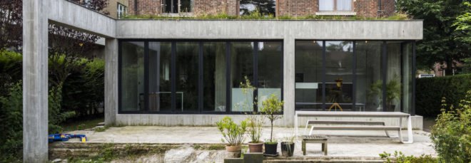 MILU by Qatarchitecten, green roof concrete extension, MILU house in Ghent, Ghent renovation and extension, board formed concrete extension, board formed concrete structural walls, operable glass garden backyard doors,