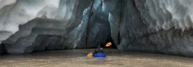 Mark Jenkins kayaks into the underside of a glacier in Alaska’s Wrangell-St. Elias National Park