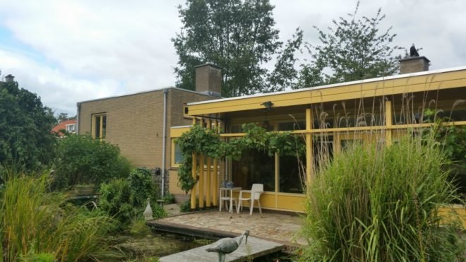 Before the renovation, the old home had a brick and yellow exterior.