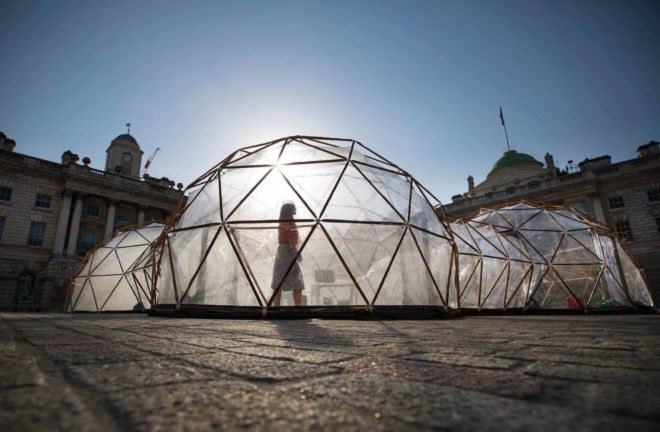 Visitor walking inside Pollution Pods by Michael Pinsky