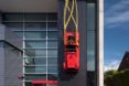 Fire truck art suspended from the building