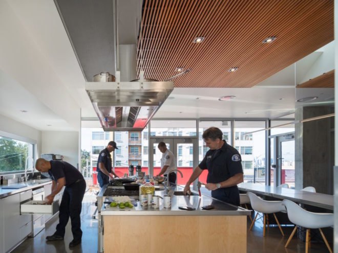 Firefighters prepping food in the kitchen and dining area