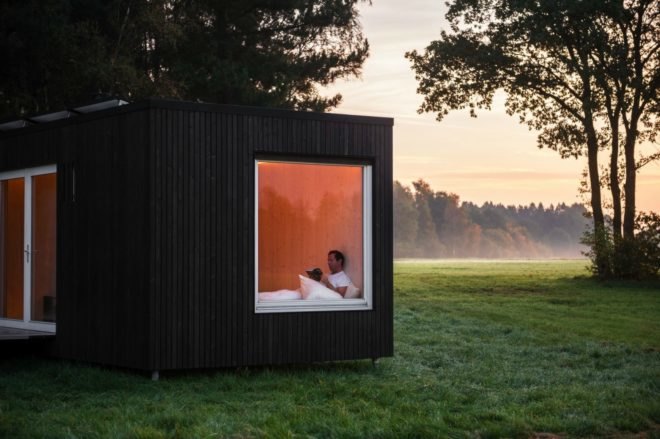 Cabin, tiny cabin, bedroom, meadow, woman reading, book