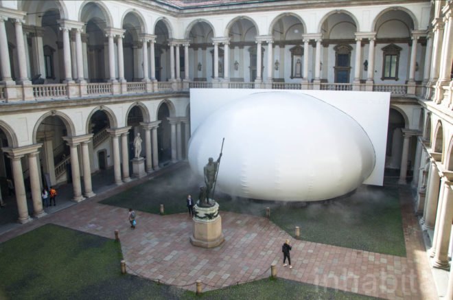 Exterior image of the installment in the middle of a pavilion.