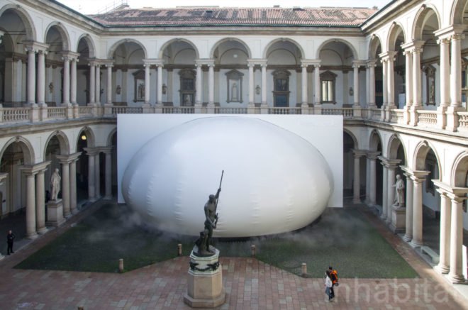 Exterior image of the installment in the middle of a pavilion.