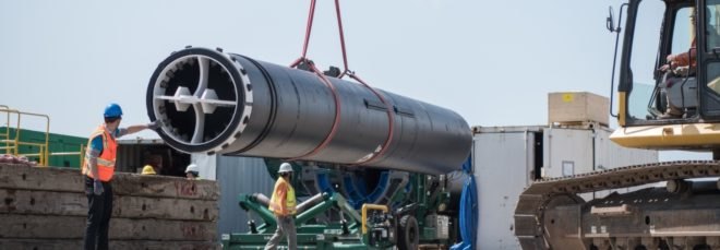 Assembly of The Ocean Cleanup's plastic-scooping system in Alameda, California