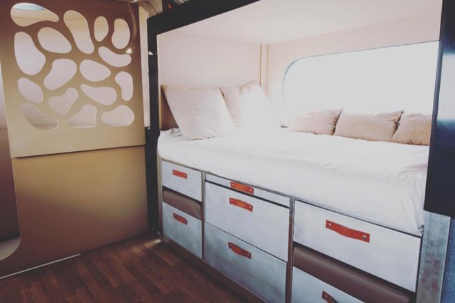 A small bed with storage space underneath.