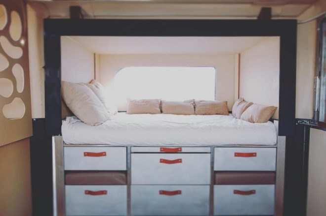 A small bed with storage space underneath.