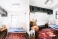 nursery with a crib and persian rugs on the floor
