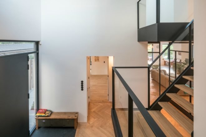 The home has light wood flooring and white walls.