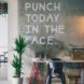 An office wall says, 