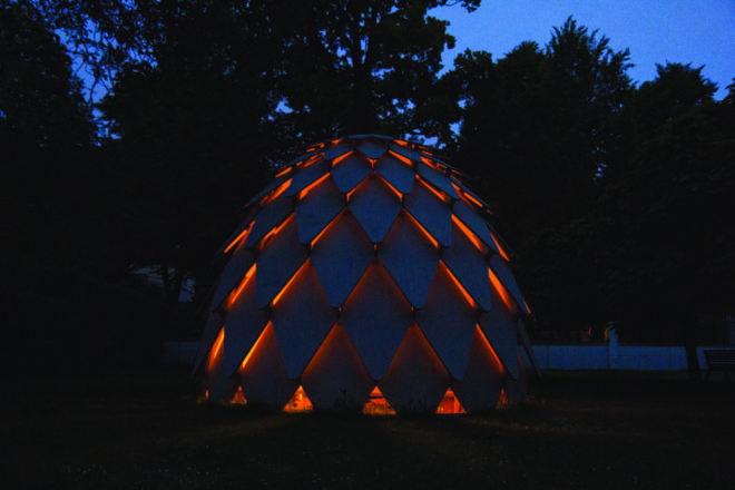 gazebo lit up at night from the campfire