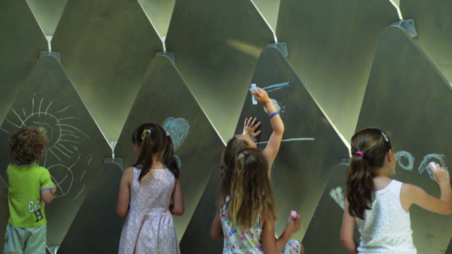 kids using chalk to draw on gazebo
