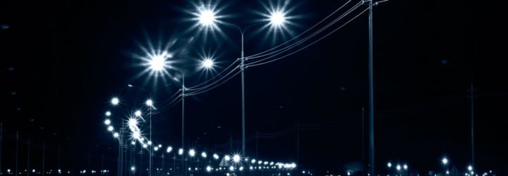 LED streetlights on an urban street at night.