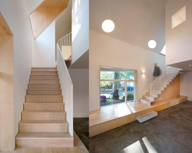 A wooden staircase and an unfurnished living space