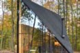 The glazed, triangular window of a tiny home