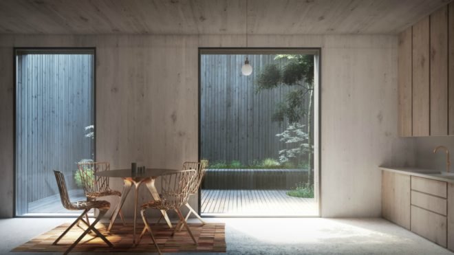A living room with a table, chairs, and a door leading out to a patio.