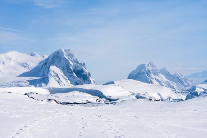 Mountain range covered in ice and snow in Antarctic