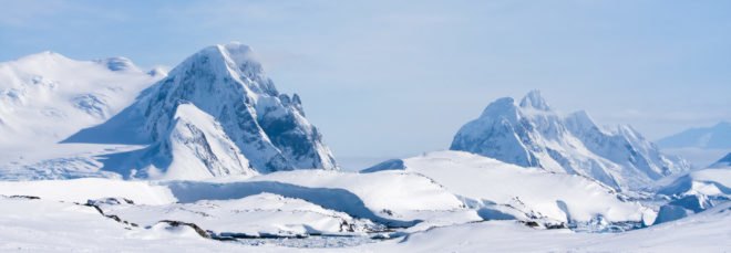 Mountain range covered in ice and snow in Antarctic