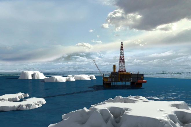 An oil pump in a blue sea with ice floes