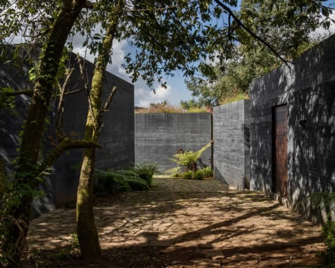 Walkways connect the blackened concrete buildings