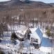 Aerial view of a cabin and its modern extension