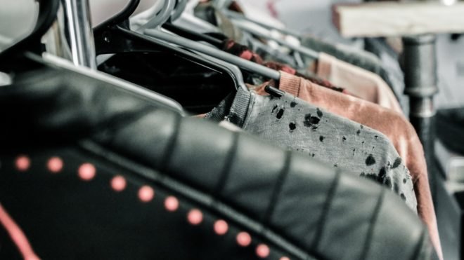 A row of clothing on hangers