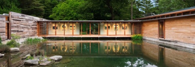 Glazed bridge connects two volumes of the home