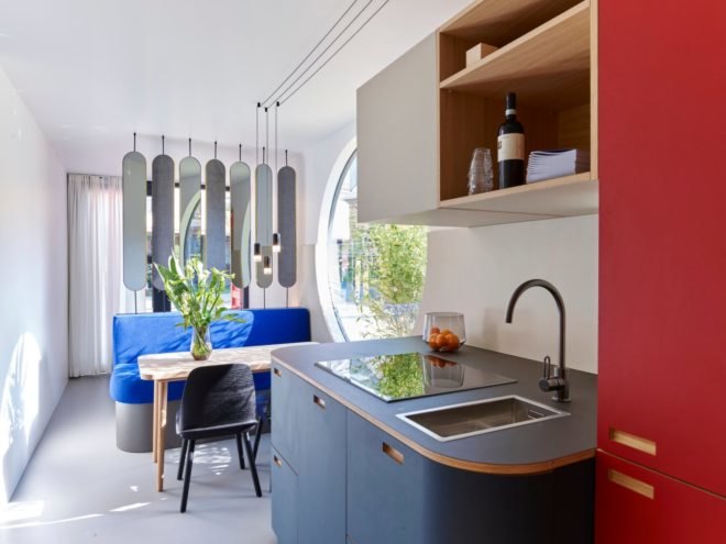 kitchen with dining area in the background