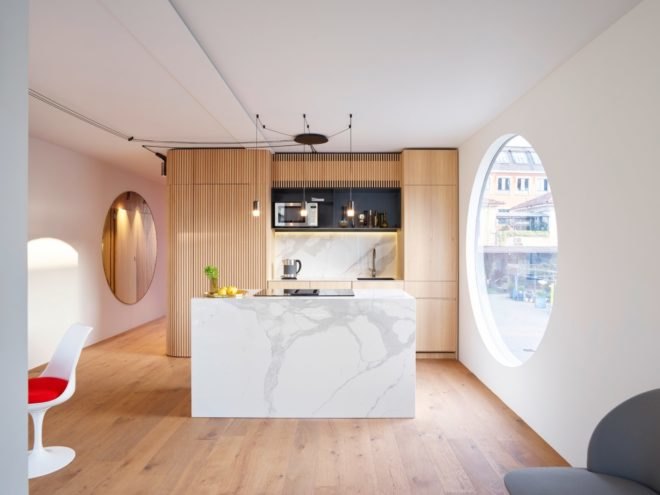 kitchen area with wooden floors and cupboards