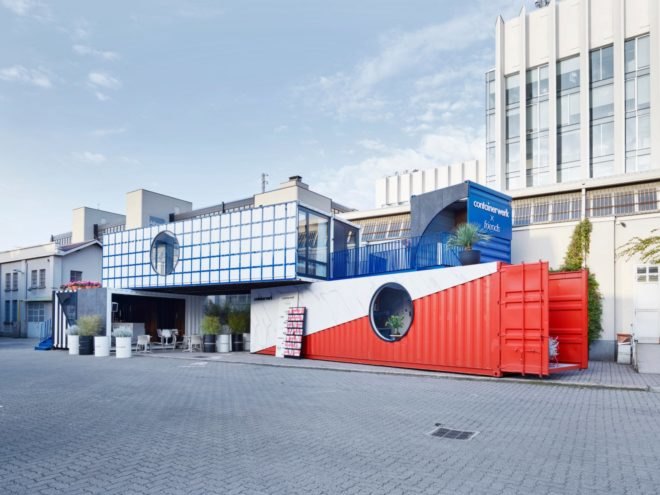 Colorful shipping containers painted blue, red and checkered