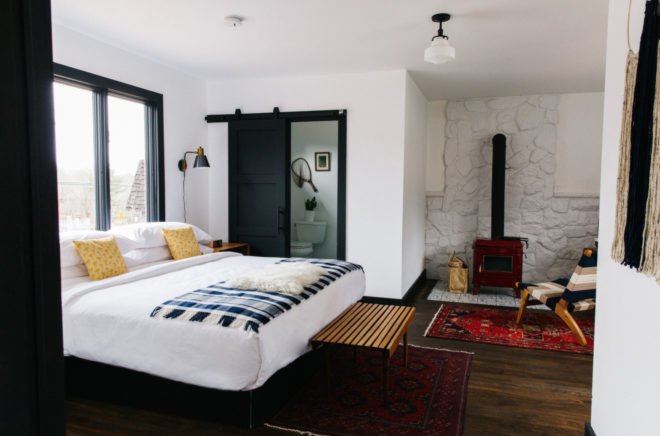 hotel bed with checkered blanket